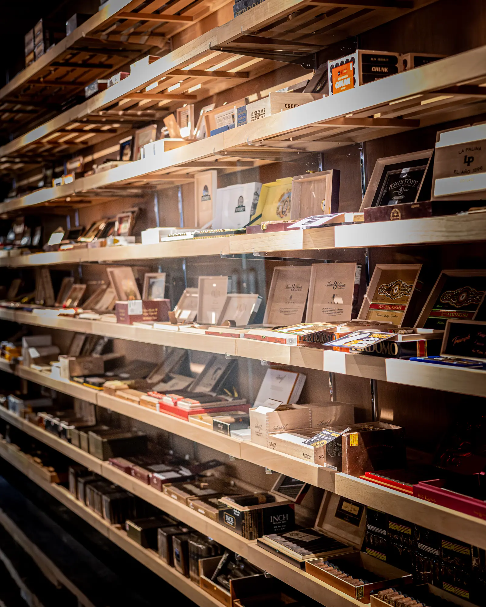 Cigar boxes on the humidor shelves
